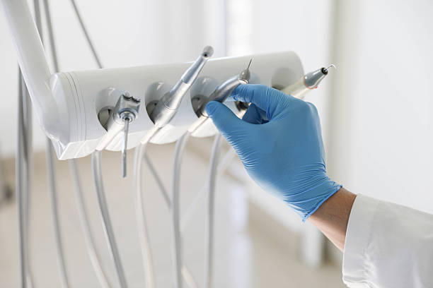 Professional Tooth Extraction technician working in Manistee County County, MI